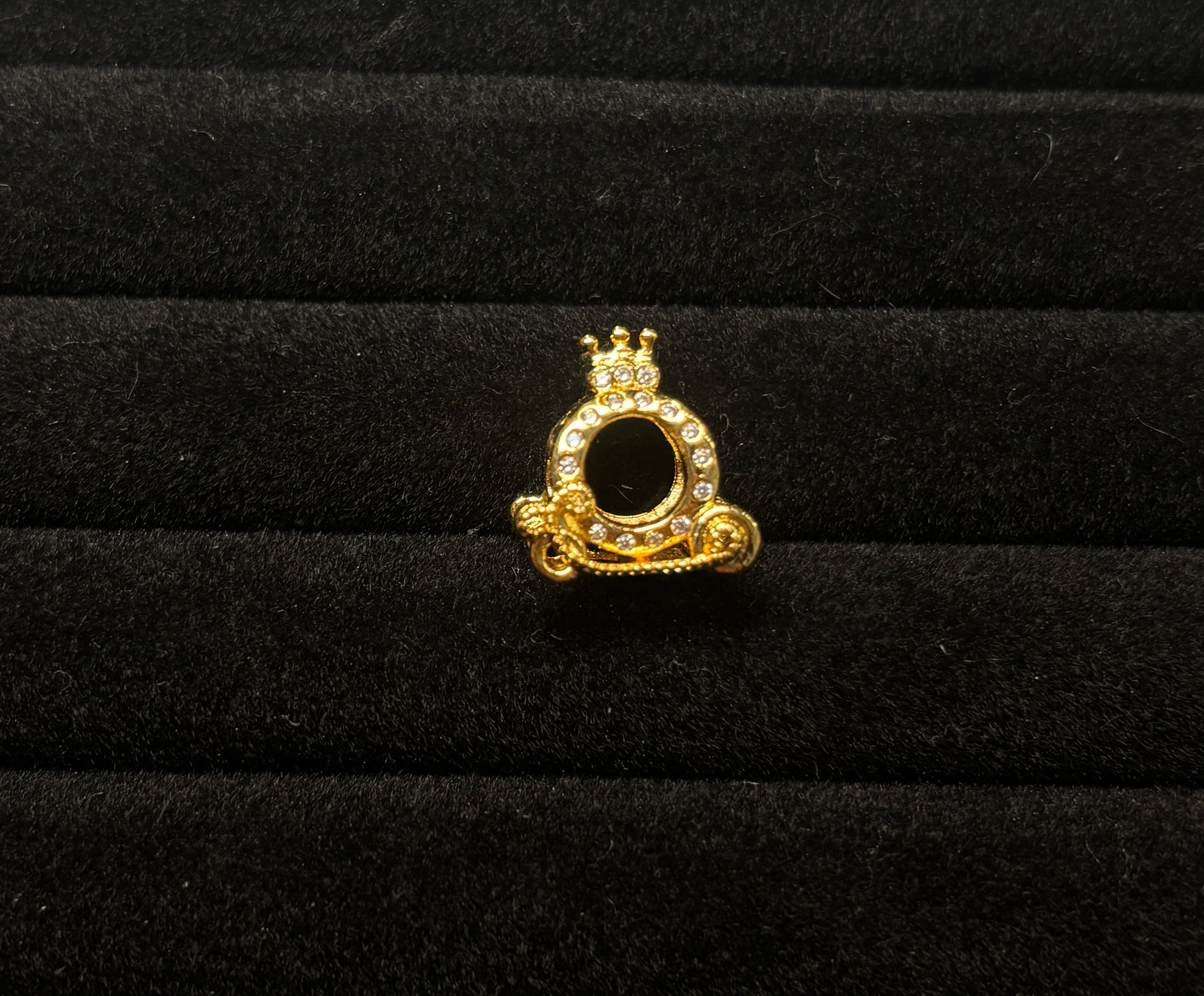 Gold carriage charm