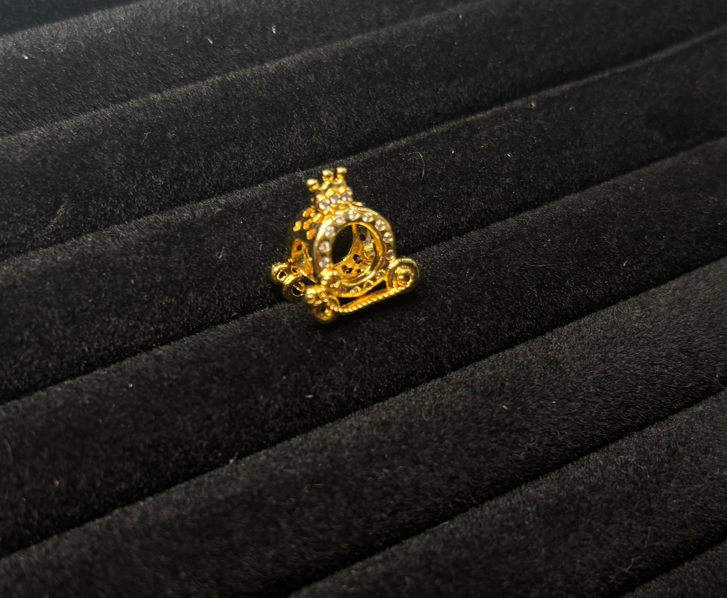 Gold carriage charm